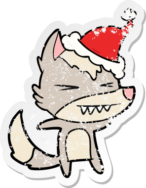 Kızgın kurt eli, bir insan tarafından çizilmiş Noel Baba şapkasının üzgün çıkartmasını çizmiş.