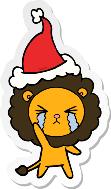Ağlayan bir aslanın insan tarafından çizilmiş Noel Baba şapkası taktığı el yazısı.