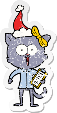 Bir insan tarafından çizilmiş Noel Baba şapkası takan bir kedinin çizilmiş el yazısı.