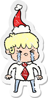 Bir insanın çizdiği Noel Baba şapkasıyla ağlayan bir çocuğun el yazısı.