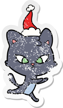 Bir insan tarafından çizilmiş Noel Baba şapkası takan bir kedi çizilmiş.