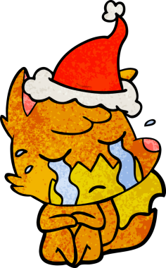 Ağlayan tilki eli bir insan tarafından çizilmiş Noel Baba şapkası.