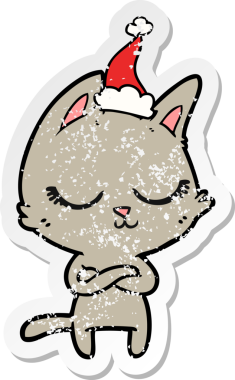 Sakin bir el, kederli bir insan tarafından çizilmiş Noel Baba şapkası takan bir kedinin çıkartması.