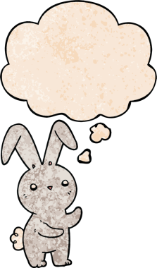 Bir insan tarafından çizilmiş grunge desenli düşünce baloncuklu şirin çizgi film tavşanı.