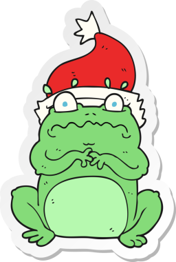 Bir insan tarafından çizilmiş Noel şapkalı bir kurbağa çıkartması.