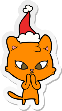 Bir insan tarafından çizilmiş Noel Baba şapkası takan bir kedinin çizilmiş şirin el yazısı.