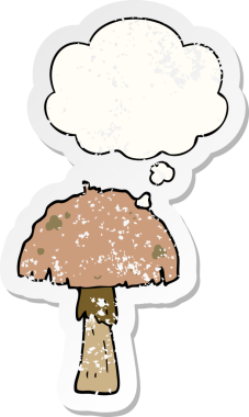 Düşünce baloncuğu olan karikatür mantarı insan tarafından çizilmiş yıpranmış bir çıkartma.