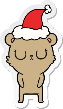 Bir insan tarafından çizilmiş Noel Baba şapkası takan bir ayının barışçıl el yazısı.