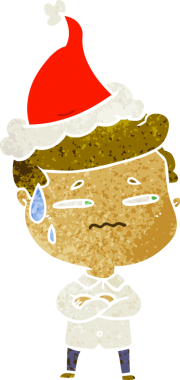 Bir insan tarafından çizilmiş Noel Baba şapkası giymiş endişeli bir adamın el çizimi karikatürü.