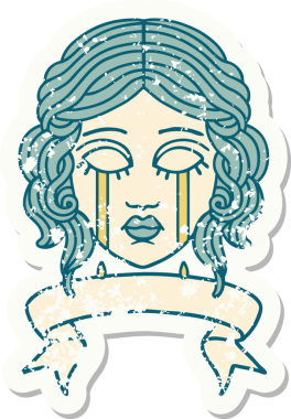 Bir insan tarafından çizilmiş kadın yüzü dövmeli eski bir etiket.