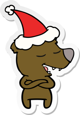 Bir insan tarafından çizilmiş Noel Baba şapkası takan bir ayının el yazısı.