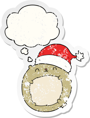 Düşünce baloncuğu olan şirin bir çizgi film Noel ayısı. Bir insan tarafından çizilmiş yıpranmış bir çıkartma.