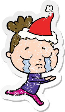 Bir insan tarafından çizilmiş, ağlayan, Noel Baba şapkası takan bir kadın.