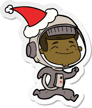 Bir insan tarafından çizilmiş Noel Baba şapkası giyen bir astronotun mutlu el çizimi karikatürü.