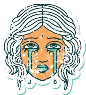 Bir insan tarafından çizilmiş ağlayan kadın yüzünün sembolik dövmeli görüntüsü.