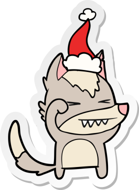 Yorgun kurt eli bir insan tarafından çizilmiş Noel Baba şapkasının çıkartması.