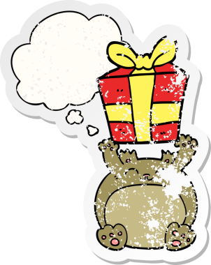 Düşünce baloncuğu olan şirin bir çizgi film Noel ayısı. Bir insan tarafından çizilmiş yıpranmış bir çıkartma.