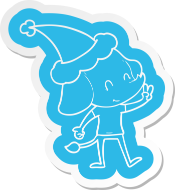 Bir insan tarafından çizilmiş Noel Baba şapkası giyen bir filin komik çizgi film çıkartması.