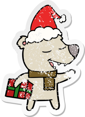 Bir insan tarafından çizilmiş Noel Baba şapkası takan bir ayının el çizimi karikatürü.