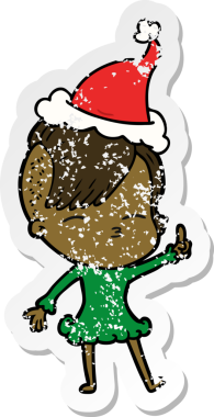 Bir insan tarafından çizilmiş Noel Baba şapkası giyen, gözlerini kısmış bir kızın el yazısı.