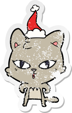 Bir insan tarafından çizilmiş Noel Baba şapkası takan bir kedinin çizilmiş el yazısı.