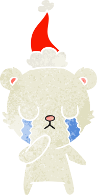 Ağlayan kutup ayısı eli bir insanın çizdiği Noel Baba şapkasının eski çizgi filmini çizdi.