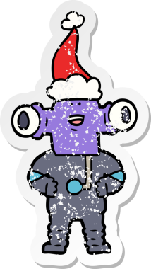 Dost canlısı el, bir insan tarafından çizilmiş Noel Baba şapkası giymiş bir uzaylının üzgün çıkartması.