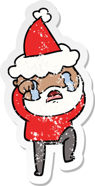 Bir insanın çizdiği Noel Baba şapkasıyla ağlayan ve ayağını yere vuran sakallı bir adamın el yazısı.