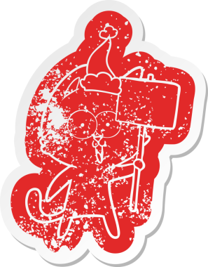 Komik karikatür. Bir insan tarafından çizilmiş Noel Baba şapkası takan kedi etiketi.