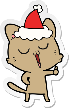 Bir insan tarafından çizilmiş Noel Baba şapkası giymiş bir kedinin el çizimi karikatürü.