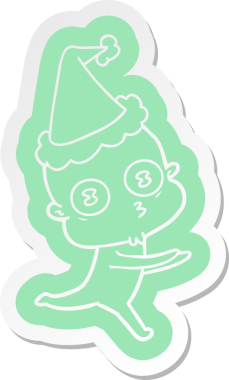 Bir insan tarafından çizilmiş Noel Baba şapkasıyla koşan kel bir uzaylının garip çizgi film çıkartması.