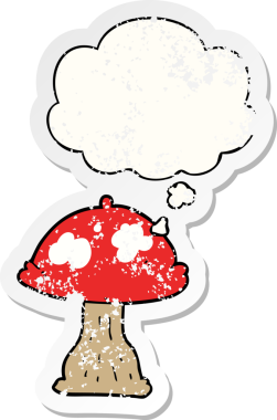 Düşünce baloncuğu olan karikatür mantarı insan tarafından çizilmiş yıpranmış bir çıkartma.