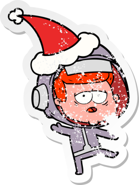 Bir insan tarafından çizilmiş Noel Baba şapkası giymiş yorgun bir astronotun el çizimi karikatürü.