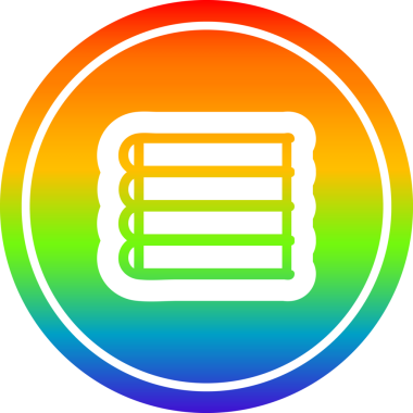 Bir insan tarafından çizilmiş gökkuşağı gradyanı olan bir yığın kitap.