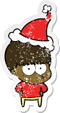 Sinirli el, bir insan tarafından çizilmiş Noel Baba şapkası takan bir çocuğun çizilmiş çıkartması.