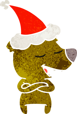 Bir insan tarafından çizilmiş Noel Baba şapkası giyen bir ayının el çizimi karikatürü.