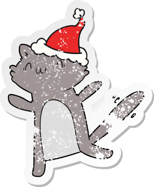 Bir insan tarafından çizilmiş Noel Baba şapkası giymiş dans eden bir kedinin el yazısı.