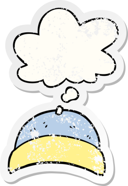 Düşünce baloncuklu çizgi film şapkası bir insan tarafından çizilmiş yıpranmış bir çıkartma gibi.