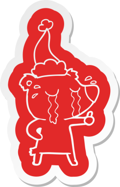 Bir insan tarafından çizilmiş Noel Baba şapkası takan ağlayan bir ayının garip çizgi film çıkartması.