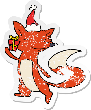 Bir insan tarafından çizilmiş Noel Baba şapkası giymiş mutlu bir tilkinin el çizimi çıkartması.