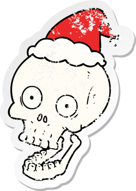 Bir insan tarafından çizilmiş Noel Baba şapkası giymiş bir kafatası çıkartması.