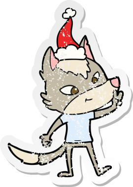 Dost canlısı el, bir insanın çizdiği Noel Baba şapkasıyla barış işareti veren bir kurt çıkartması çizdi.