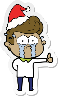 Bir insan tarafından çizilmiş Noel Baba şapkası takan ağlayan bir adamın el yazısı.