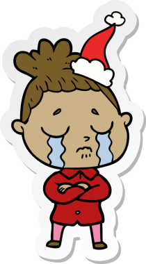 Bir insan tarafından çizilmiş Noel Baba şapkası giyen ağlayan bir kadının el yazısı.