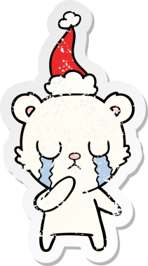 Ağlayan kutup ayısı eli bir insanın çizdiği Noel Baba şapkasının çizilmiş çıkartması.