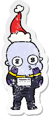 Bir insan tarafından çizilmiş Noel Baba şapkası giymiş garip kel bir uzaylının çizilmiş el yazısı.