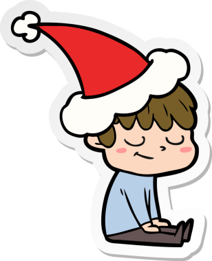 Bir insan tarafından çizilmiş Noel Baba şapkası takan mutlu bir çocuğun el yazısı.