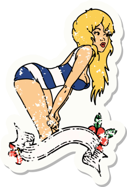 Geleneksel stil dövmeli, yüzme kostümlü, pankartı insan dövmeli bir kız dövmesi.