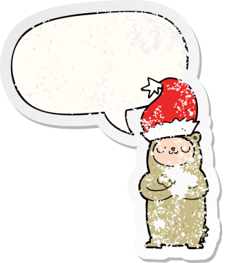 Karikatür ayısı Noel şapkası takıyor ve konuşma baloncuğu takıyor. Bir insan tarafından çizilmiş sıkıntılı eski bir çıkartma.