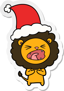 Bir insan tarafından çizilmiş Noel Baba şapkası takan bir aslanın el yazısı.